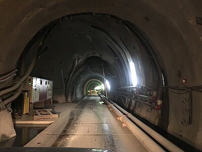 Inside the Brenner Base Tunnel: tunnel tube with pipework and electrical control cabinets during construction